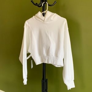 TNA CozyAF Medium sized cropped hoodie.